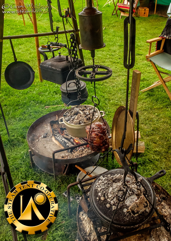 A shoulder of lamb roasting by the fire -The Steam Tent Co-operative.  Gary Waidson - www.Steamtent.uk